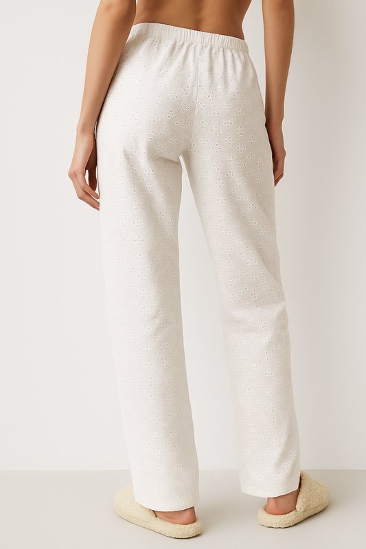Women’s white wide-leg trousers with embroidered detailing and elastic waistband—loose fit for casual and chic looks.