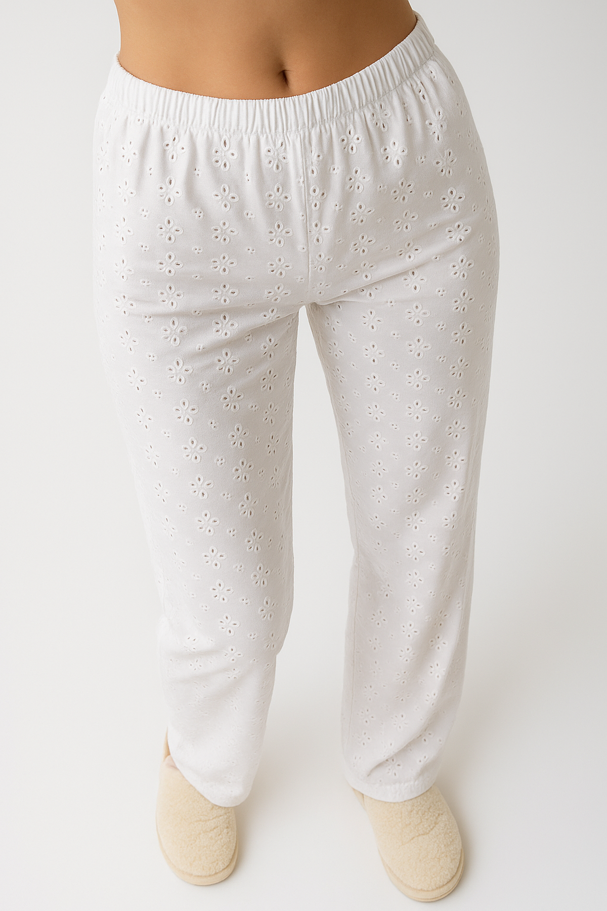 Women’s white wide-leg trousers with embroidered detailing and elastic waistband—loose fit for casual and chic looks.