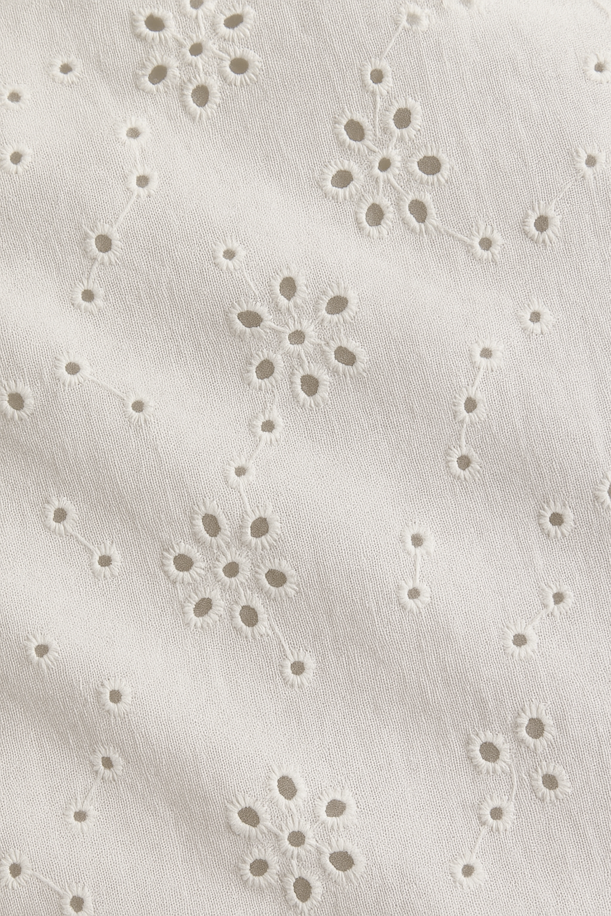 Women’s white wide-leg trousers with embroidered detailing and elastic waistband—loose fit for casual and chic looks.